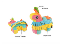 P.L.A.Y. Party Animal Piñata dog toy being used by a dog during interactive treat-dispensing playtime.