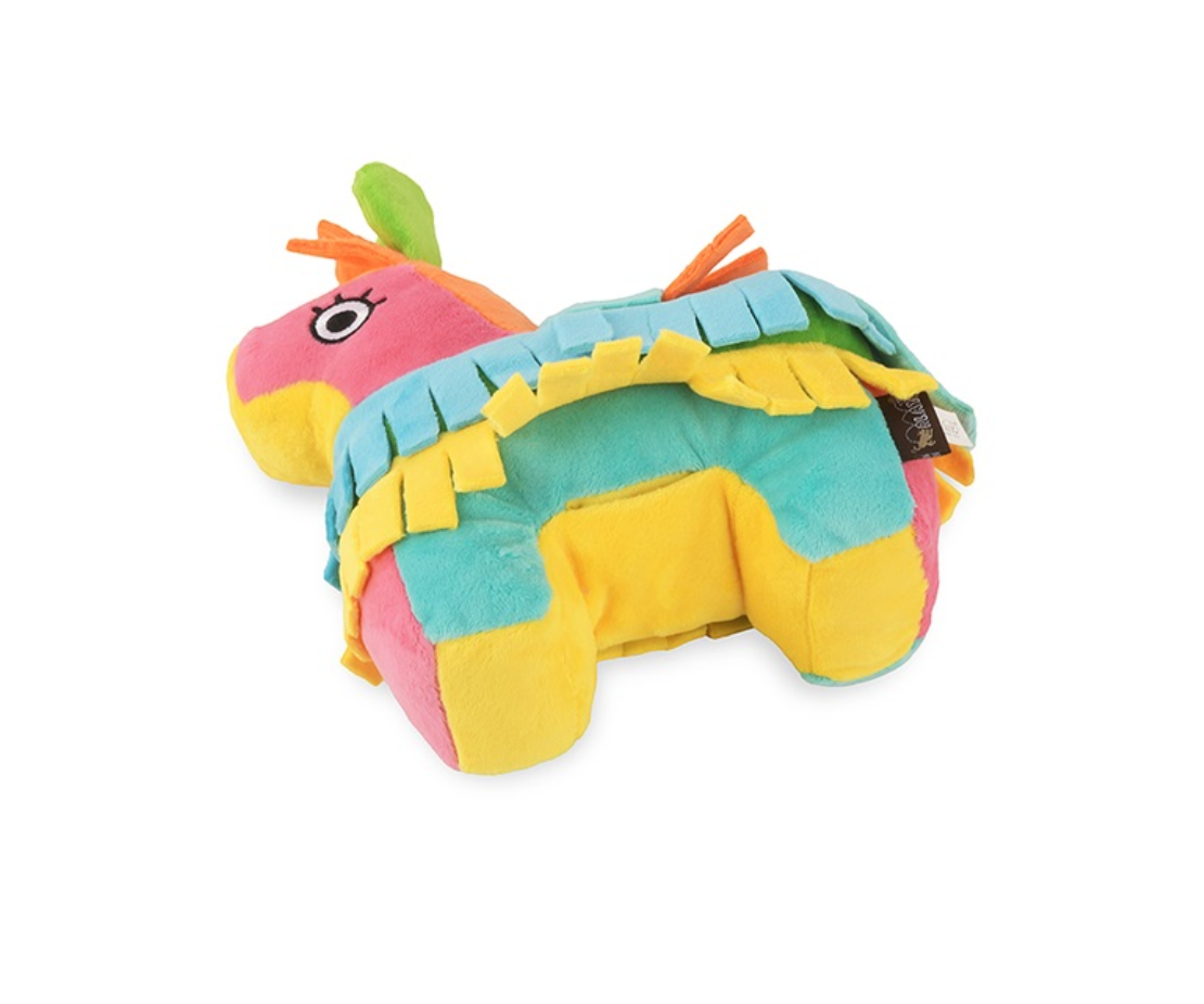 P.L.A.Y. Party Animal Piñata dog toy shown in lifestyle setting with happy dog playing and enjoying treats.
