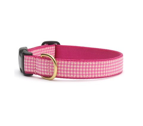 Pink gingham dog collar with a gold buckle on a white background