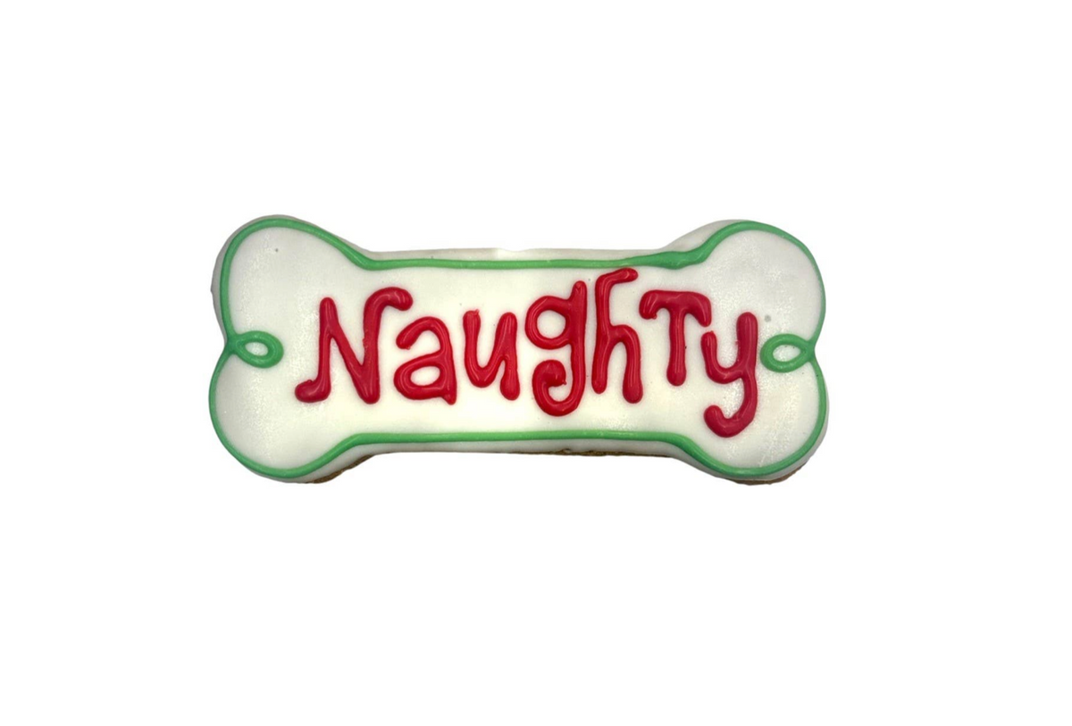 Holiday Naughty Bones dog treats from Paws Gourmet Bakery in festive bone-shaped design with peanut butter coating.