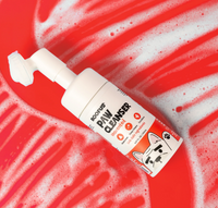Roofus Foaming Paw Cleanser bottle showing built-in soft brush applicator and no-rinse formula details.