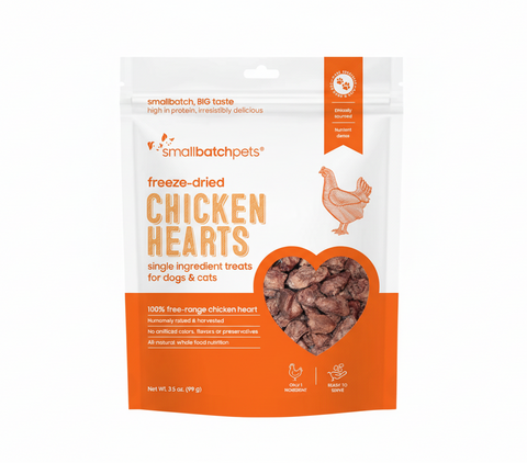 Small Batch freeze-dried chicken heart dog treats in clear packaging showing brown heart-shaped pieces.