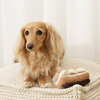 Lambwolf Collective Eclair snuffle toy showing detailed view of textured cream flaps and treat-dispensing pockets.