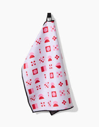 Geometry Heart Quilt Paw Towel being used to dry a dog's paws after outdoor activity.