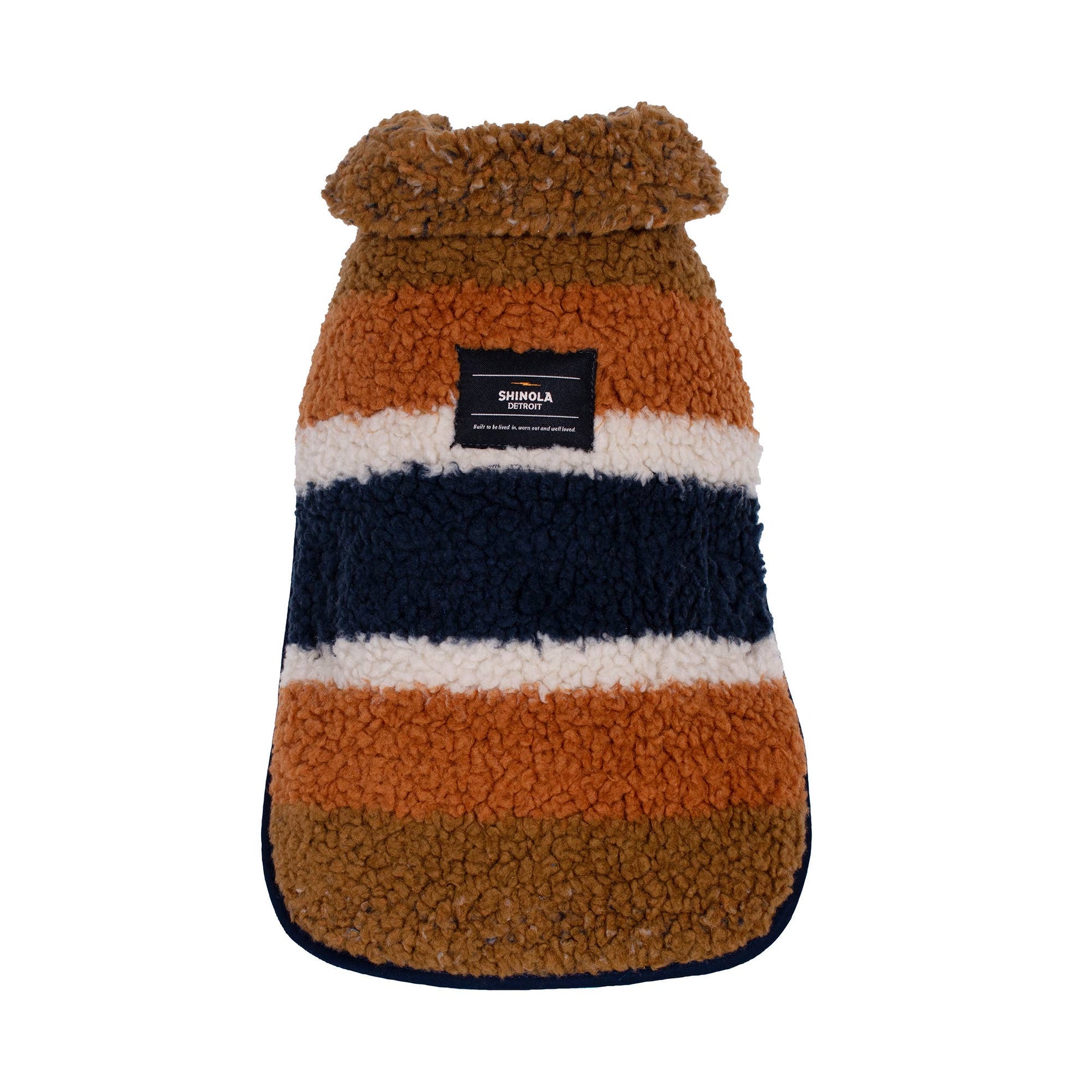 Shinola Pet Brown Adjustable Barn Style Dog Coat detail showing reversible design and genuine shearling lining.