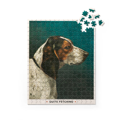 Chronicle Books Quite Fetching puzzle showing vintage English Foxhound painting assembled on table with puzzle box nearby.
