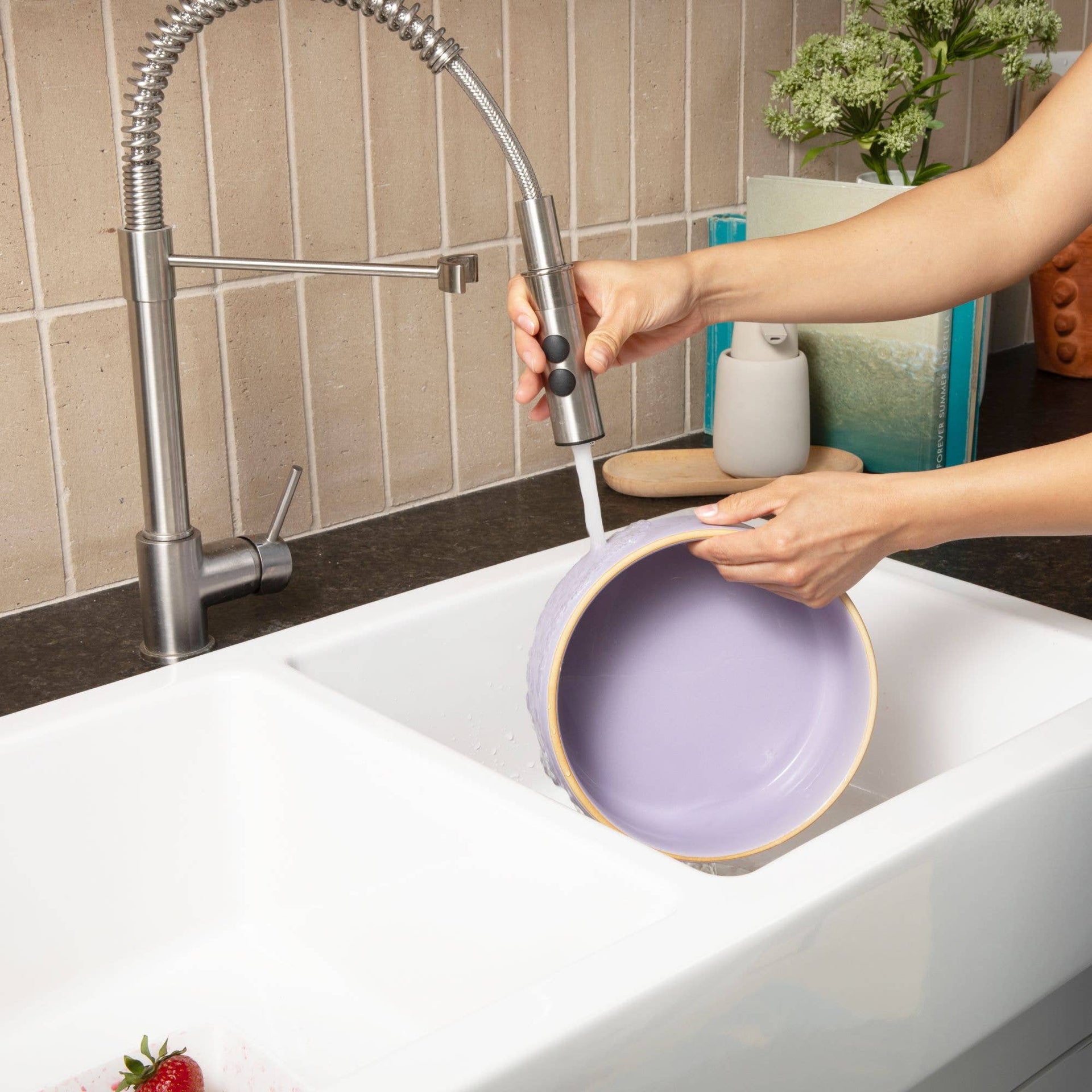 Waggo Olive Edge Bowl shown in a modern kitchen setting displaying its matte ceramic finish and contemporary design.