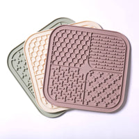 Awoo SMOOSH Lick Mat showing detailed view of four distinct textured zones for holding treats and spreads.