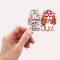 Close-up detail of the Inviting Affairs Paperie I'm Doing Weird Thanks for Asking dog sticker design.