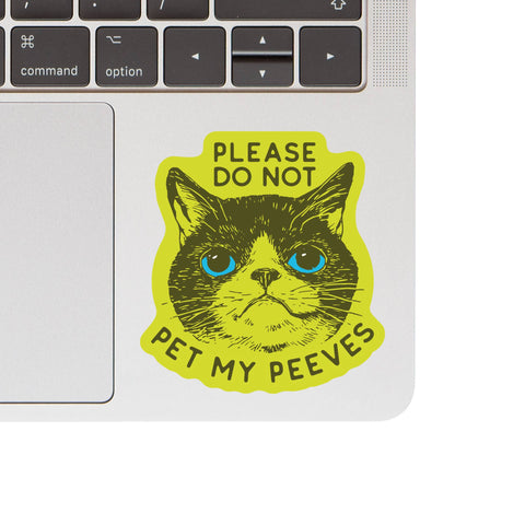 Close-up detail of Juju and Moxie My Peeves sticker showing waterproof vinyl material and humorous pet-themed design elements.