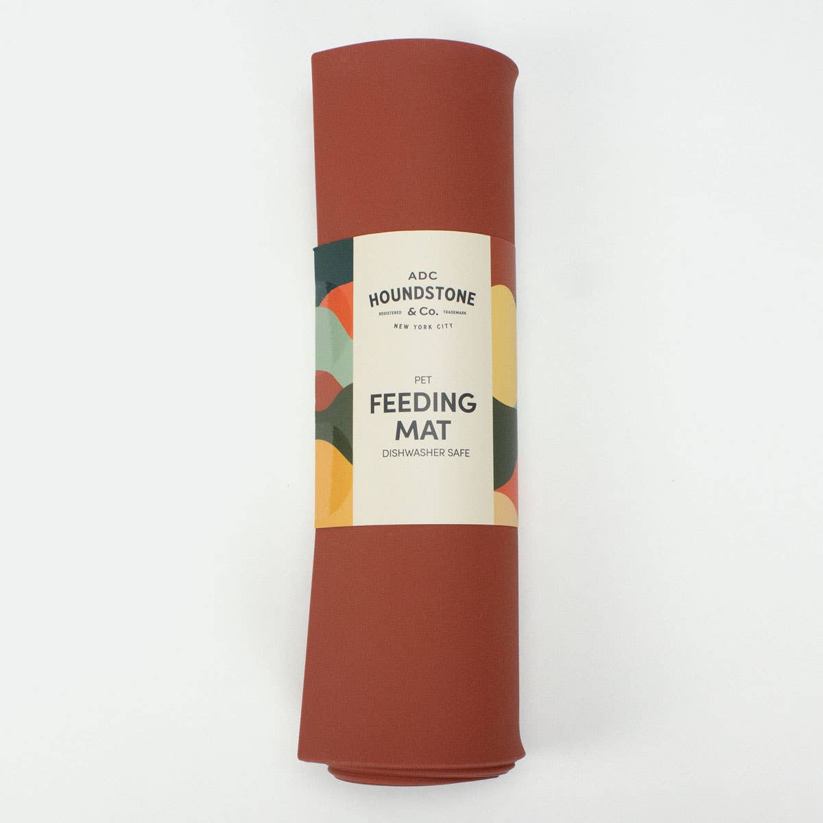 Silicone Pet Food Mat by ADC Houndstone & Co. shown in use with pet bowls on kitchen floor