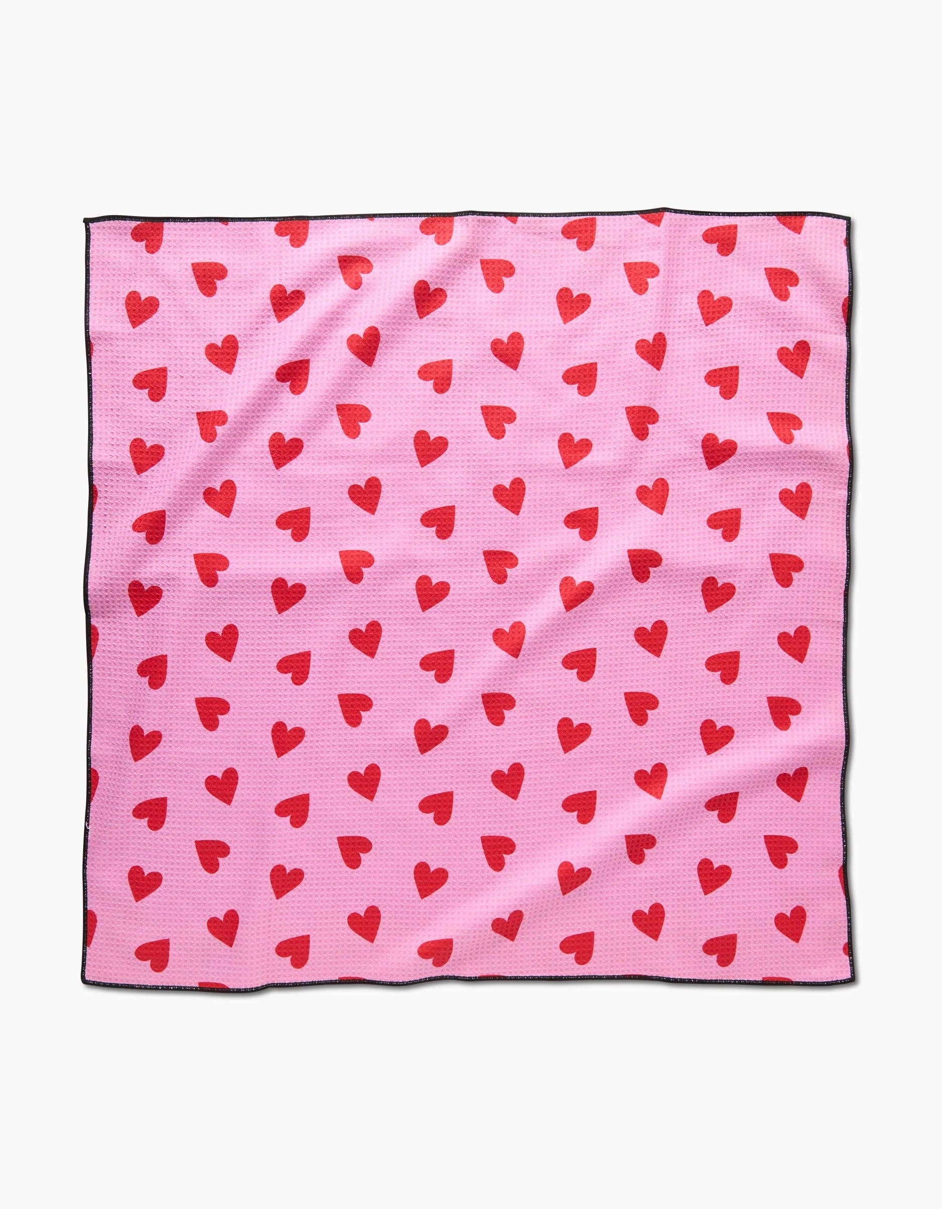 Geometry I Heart You Dog Towel in cream color with red heart pattern design displayed flat.