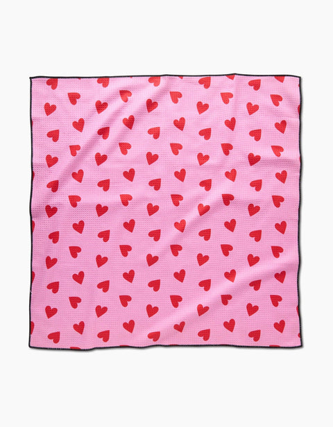 Geometry I Heart You Dog Towel in cream color with red heart pattern design displayed flat.