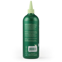 Earth Rated 3 in 1 Dog Shampoo bottle being used on a happy short-haired dog during bath time
