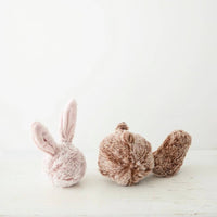 Lambwolf Collective Bunny Pop dog toy being played with by a dog showing the crinkle and plush textures.