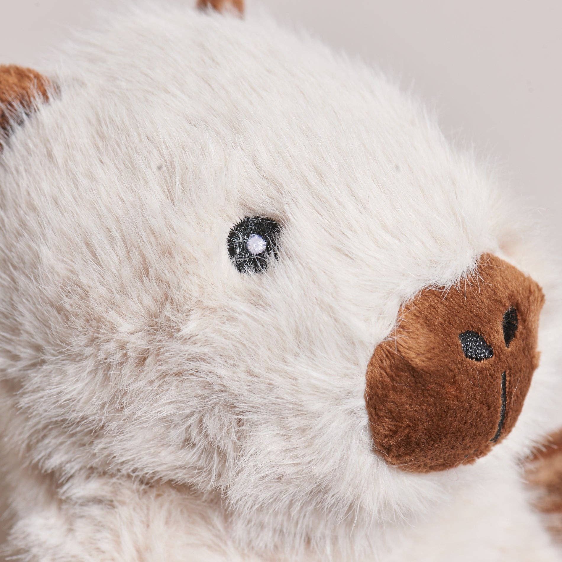X-Brace Clover Capybara dog toy shown from side angle displaying detailed stitching and construction quality.