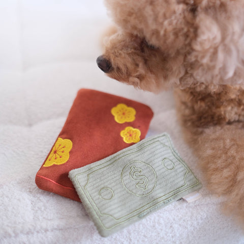 Lambwolf Collective RED POCKET enrichment toy showing crinkle texture and treat-hiding compartment detail for dogs.