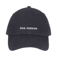Dog Dish black cotton twill baseball cap with white embroidered Dog Person text on the front