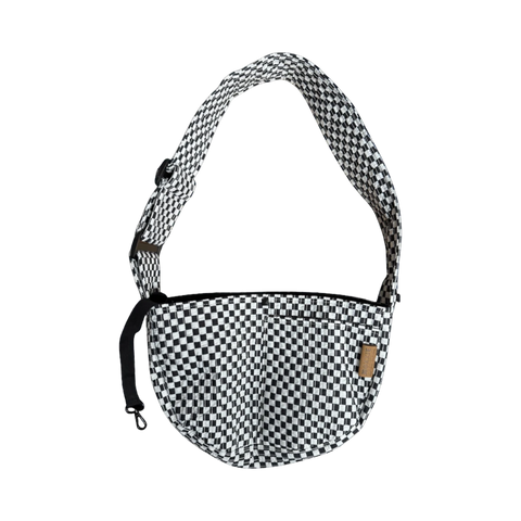 Dog Dish black and white checkered pet sling carrier with adjustable strap and interior safety clip for small dogs.