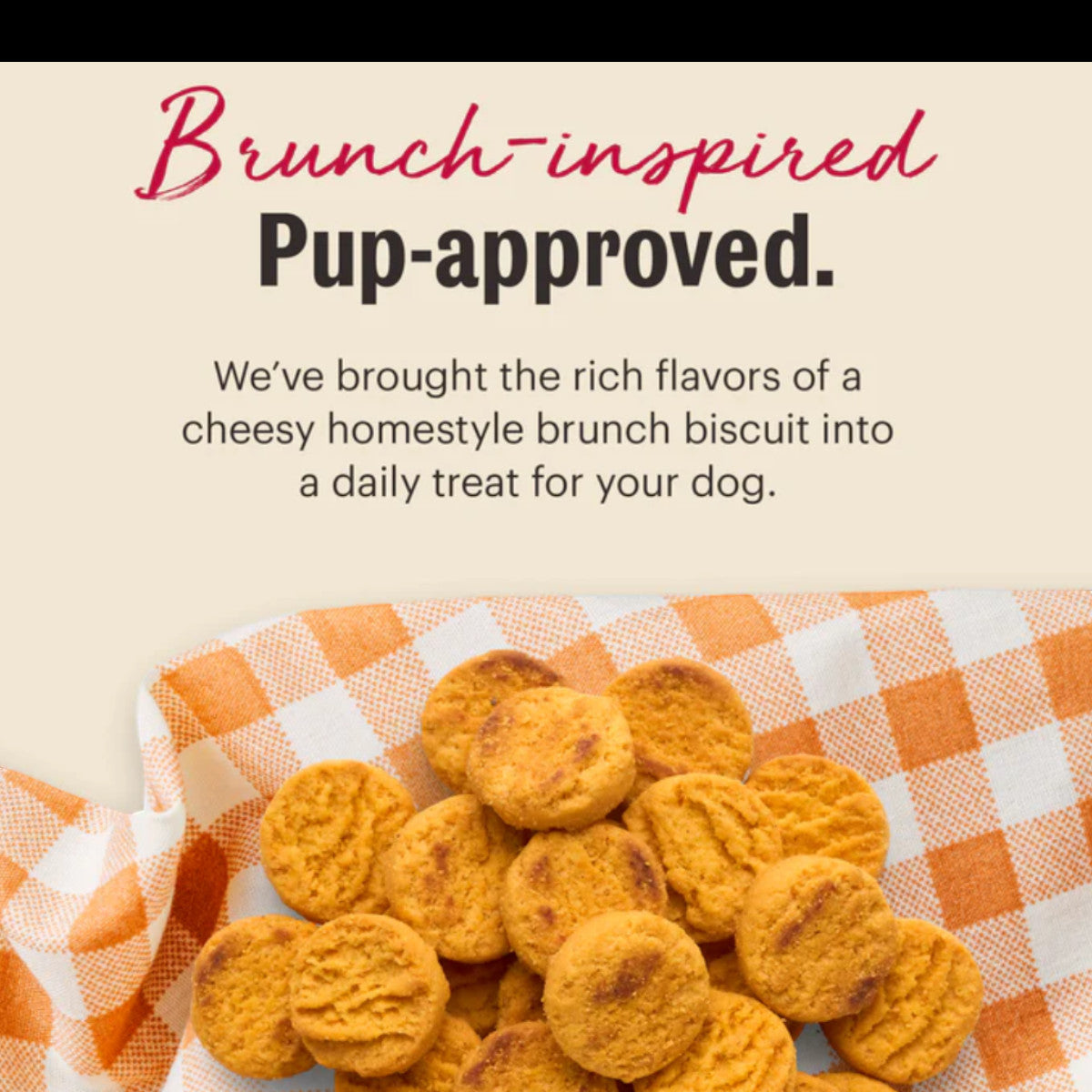 Dog Dish Honest Kitchen cheddar dog biscuits on an orange and white checkered napkin