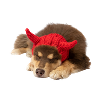 Dog Dish Devil Dog Snood in bright red acrylic knit with playful horns worn by a sleeping puppy