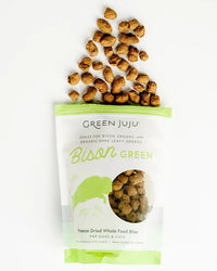 Dog Dish Green Juju Bison Green freeze-dried dog and cat treats in a white pouch with scattered brown bison bites.