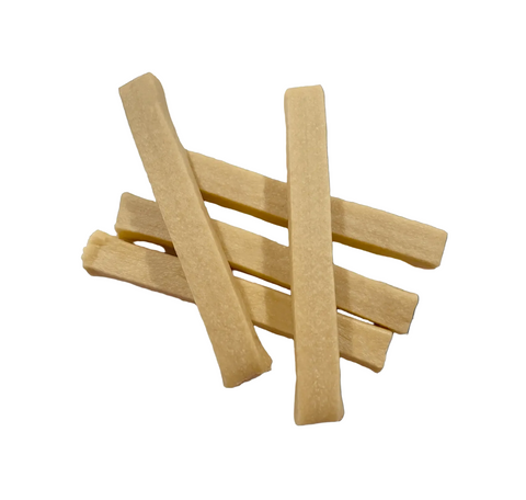 Dog Dish Himalayan bacon-flavored yogurt sticks for dogs, featuring a soft, light-tan texture for digestive health.