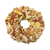 Dog Dish The Hound Dog Granola Donut topped with peanut butter, banana, and bacon pieces for dogs.