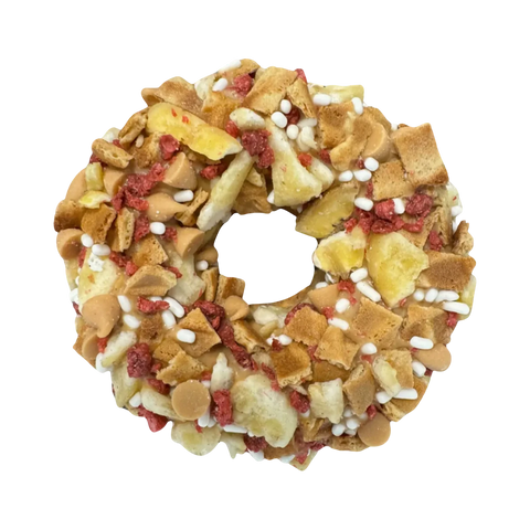 Dog Dish The Hound Dog Granola Donut topped with peanut butter, banana, and bacon pieces for dogs.
