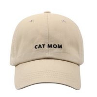Dog Dish Cat Mom baseball cap in khaki cotton twill with black embroidered lettering and adjustable metal clasp