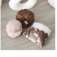 Dog Dish Lambwolf Cookie enrichment set featuring plush pastry-themed snuffle toys for small dogs on a wooden surface.