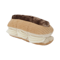 Dog Dish Lambwolf Eclair plush enrichment toy with brown chocolate icing and cream-colored treat-dispensing flaps.