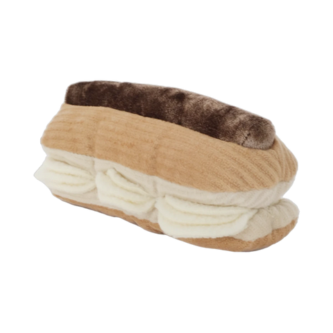 Dog Dish Lambwolf Eclair plush enrichment toy with brown chocolate icing and cream-colored treat-dispensing flaps.