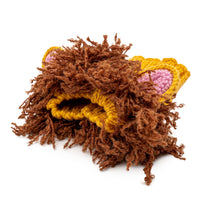 Dog Dish Lion Dog Snood featuring a hand-crocheted golden yellow knit with a fluffy brown mane and pink ear details.