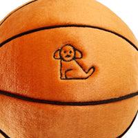 Dog Dish Fluff & Tuff plush basketball toy in orange with black seams and an embroidered puppy logo