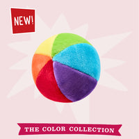Dog Dish Fluff & Tuff plush mini beach ball in vibrant multi-colored segments for soft dog play and fetching.