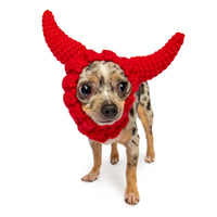 Dog Dish Devil Dog Snood featuring red knit devil horns on a small spotted dog against a white background