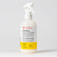 Dog Dish Skout's Honor probiotic honeysuckle detangler spray bottle for pet grooming on a white background.