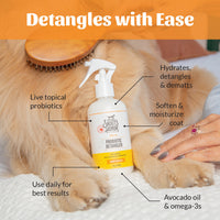 Dog Dish Skout's Honor probiotic honeysuckle detangler spray bottle being used on a golden dog's coat with a brush.