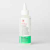 Dog Dish Skout's Honor probiotic ear cleaner bottle for cats featuring a white squeeze top and informative label.