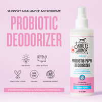 Dog Dish Skout's Honor Happy Puppy probiotic deodorizer spray bottle for dogs on a light pink background.