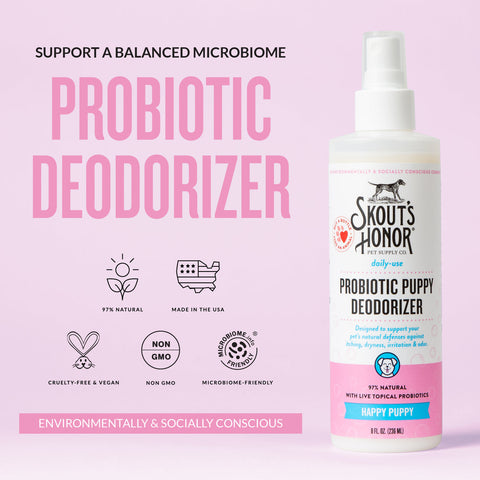 Dog Dish Skout's Honor Happy Puppy probiotic deodorizer spray bottle for dogs on a light pink background.