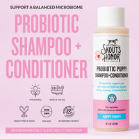 Dog Dish Skout's Honor Happy Puppy probiotic shampoo and conditioner bottle on a soft pink background.