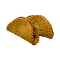 Dog Dish Bubba Rose Biscuit Co. taco-shaped beef and cheddar dog cookies on a light background