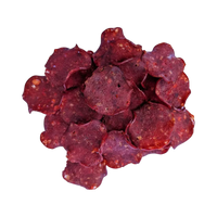 Dog Dish Wild Meadow Farms crispy beef chips for dogs, thin and crunchy meat treats on a black background.
