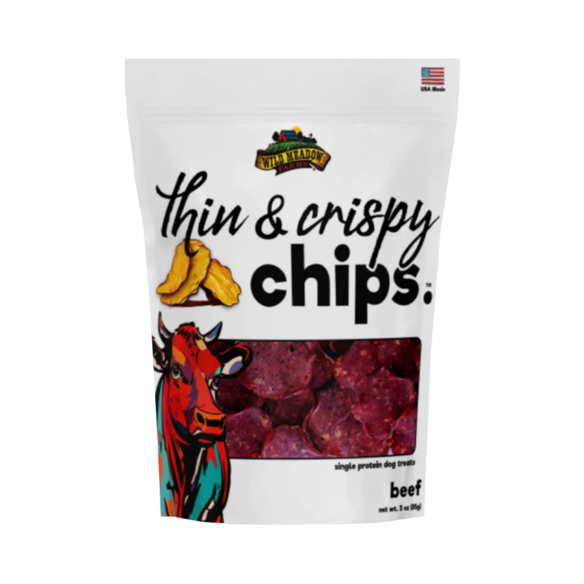 Dog Dish Wild Meadow Farms beef crispy chips in a white resealable pouch featuring a colorful cow illustration.