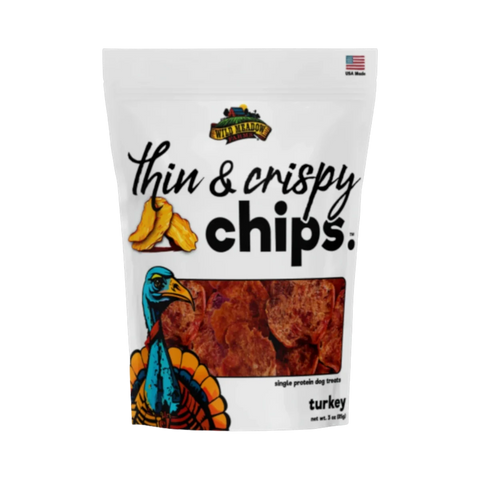 Dog Dish Wild Meadow Farms turkey crispy chips in a white pouch with a colorful turkey illustration