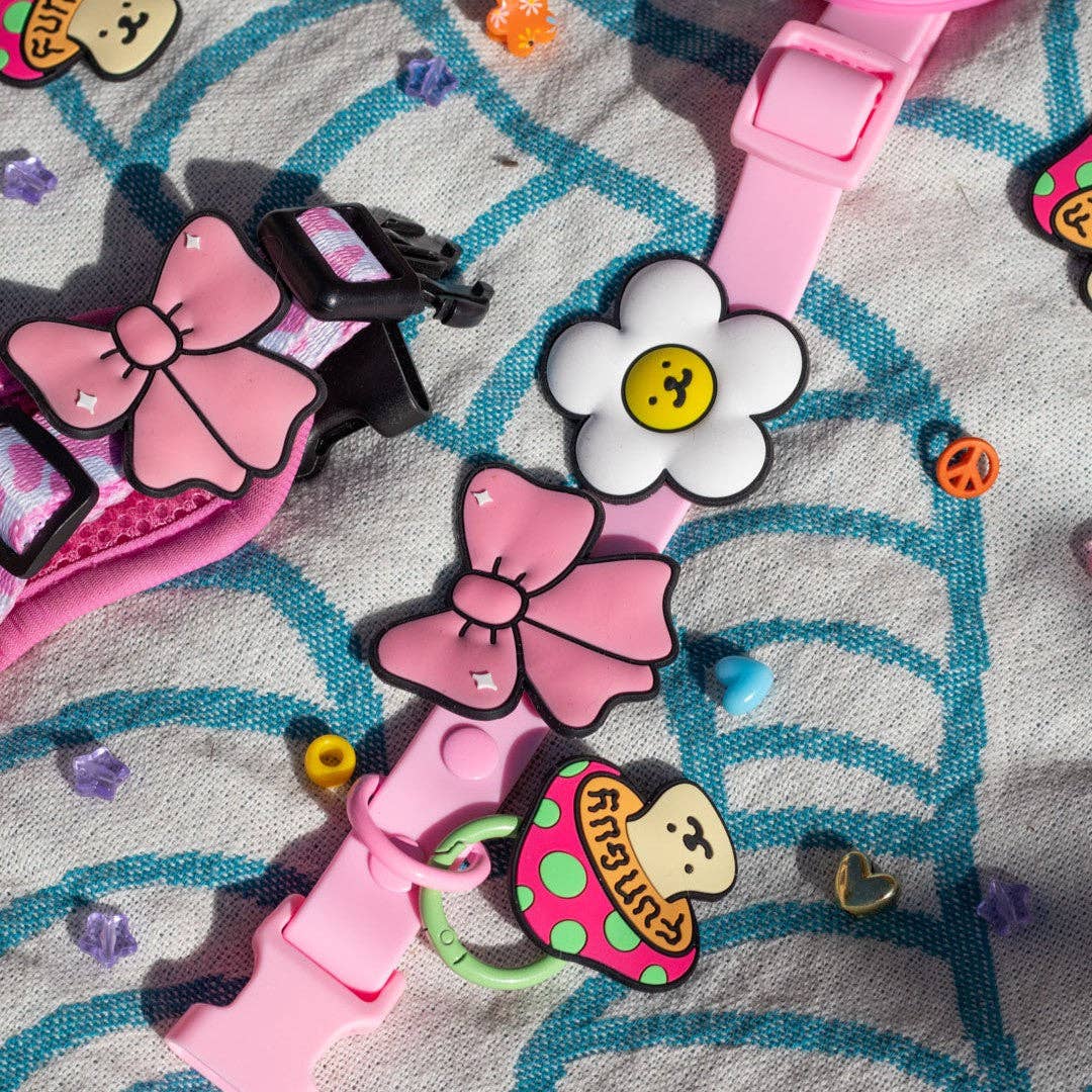 Close-up detail of the Jiby Dog Crew Ribbon Pink Jiby Dog Charm showing texture and finish.