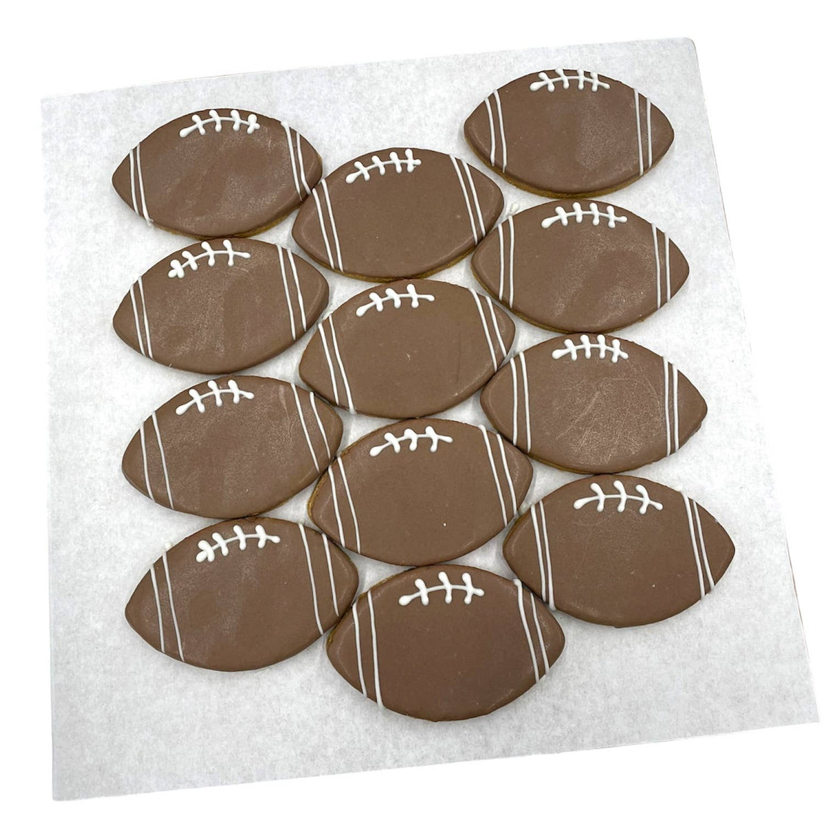 Close-up detail of a Paws Gourmet Bakery Football Cookie showing texture and icing decoration.