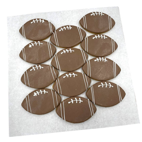 Close-up detail of a Paws Gourmet Bakery Football Cookie showing texture and icing decoration.